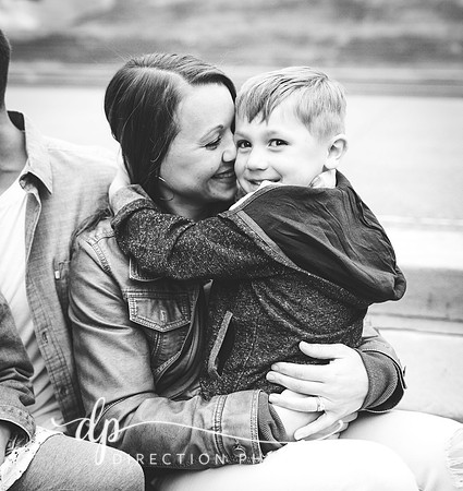A mother hugging a young boy in front of Soldiers and Sailors Monument in Indianapolis IN
