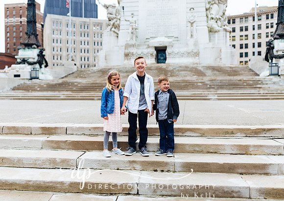 Children standing on steps in front of Soldiers and Sailors Monument in Indianapolis IN