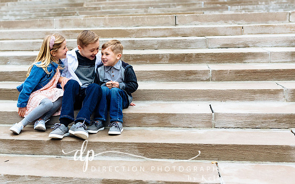 Children sitting on steps in front of Soldiers and Sailors Monument in Indianapolis IN